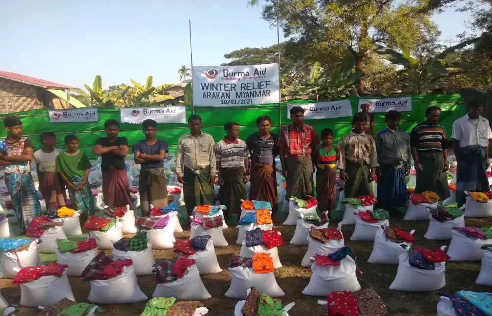 Beneficiaries receiving winter relief packages in Arakan, Myanmar